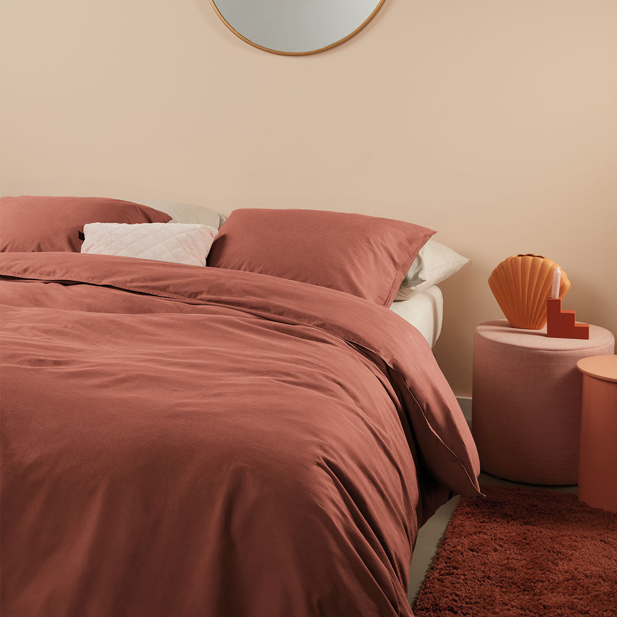 Bedding House Organic Cotton Basic Terracotta Quilt Cover Set featuring a quilt cover and two pillowcases in a warm terracotta color.