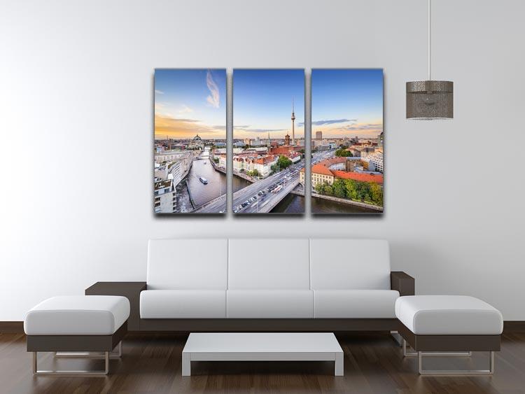 A stunning 3-panel canvas print featuring the Berlin skyline over the Spree River, showcasing vibrant colors and intricate details.