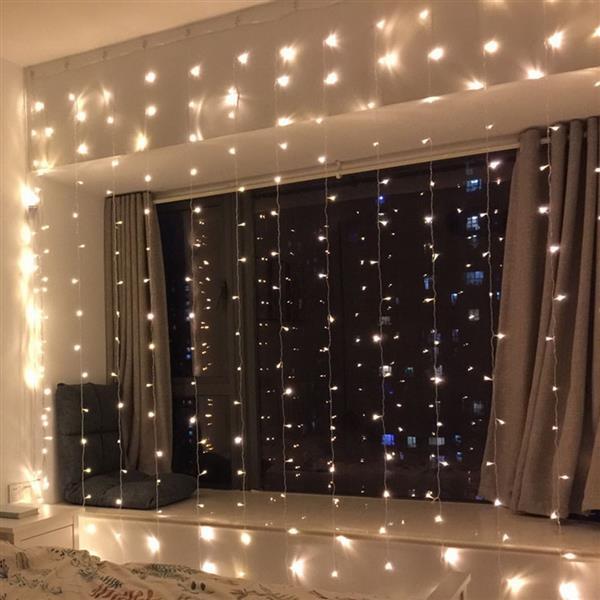 300-LED Warm White Light Curtain String Light, perfect for romantic weddings and outdoor decorations, showcasing bright LED lights in a curtain style.