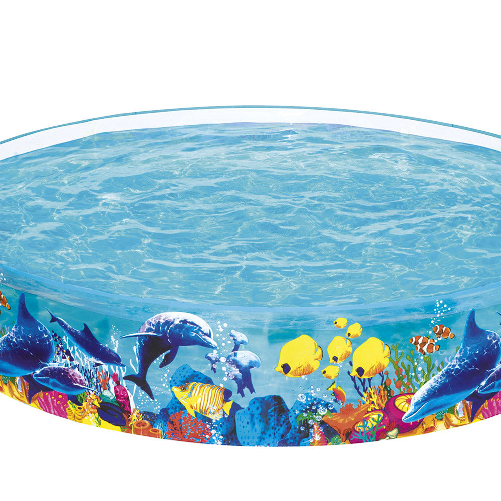 Bestway Swimming Odyssey Kids Round Pool with colorful marine life graphics, set up in a backyard, filled with water for children to play.