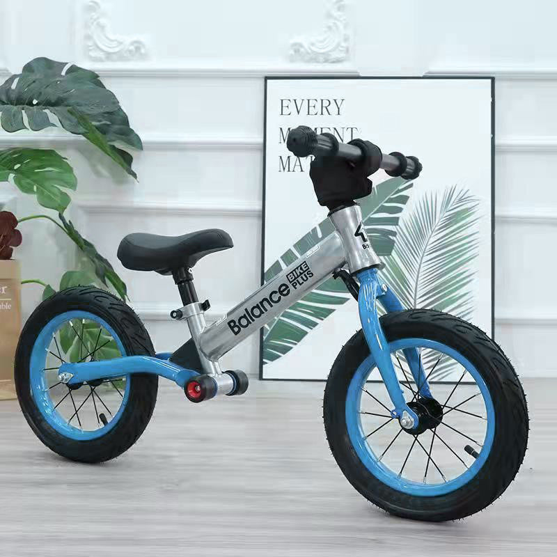 Bike Plus Kids Balance Bike in silver, featuring a lightweight aluminum frame, 12-inch spoked wheels, and an adjustable seat for children aged 2-6.