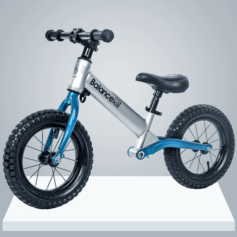 Bike Plus Kids Balance Bike in silver, featuring a lightweight aluminum frame, 12-inch spoked wheels, and an adjustable seat for children aged 2-6.