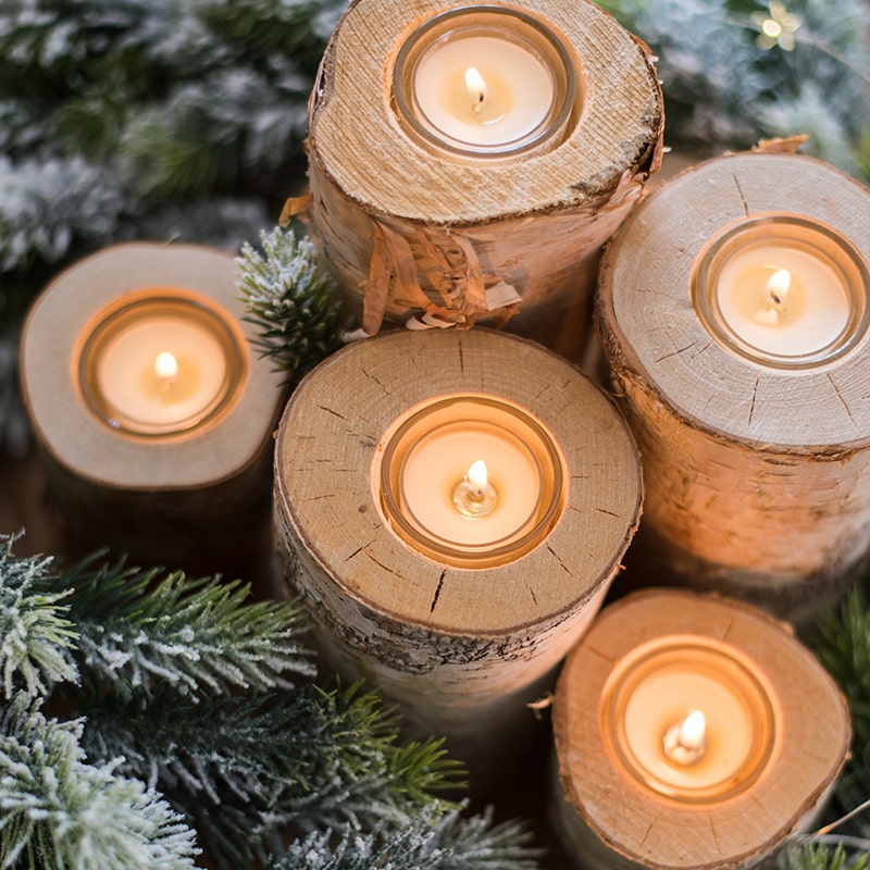 Birch wood candle holder for tea lights, showcasing natural wood grain and available in various sizes.
