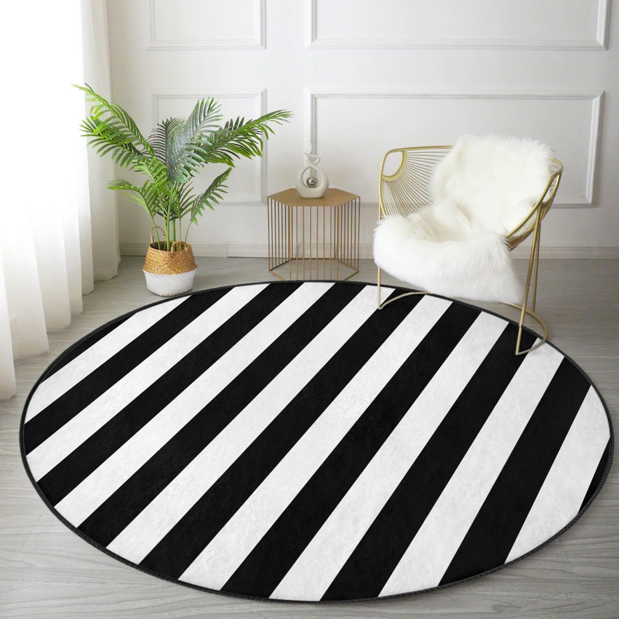 A stylish black and white patterned round rug, showcasing a soft velvet texture, perfect for enhancing living room decor.