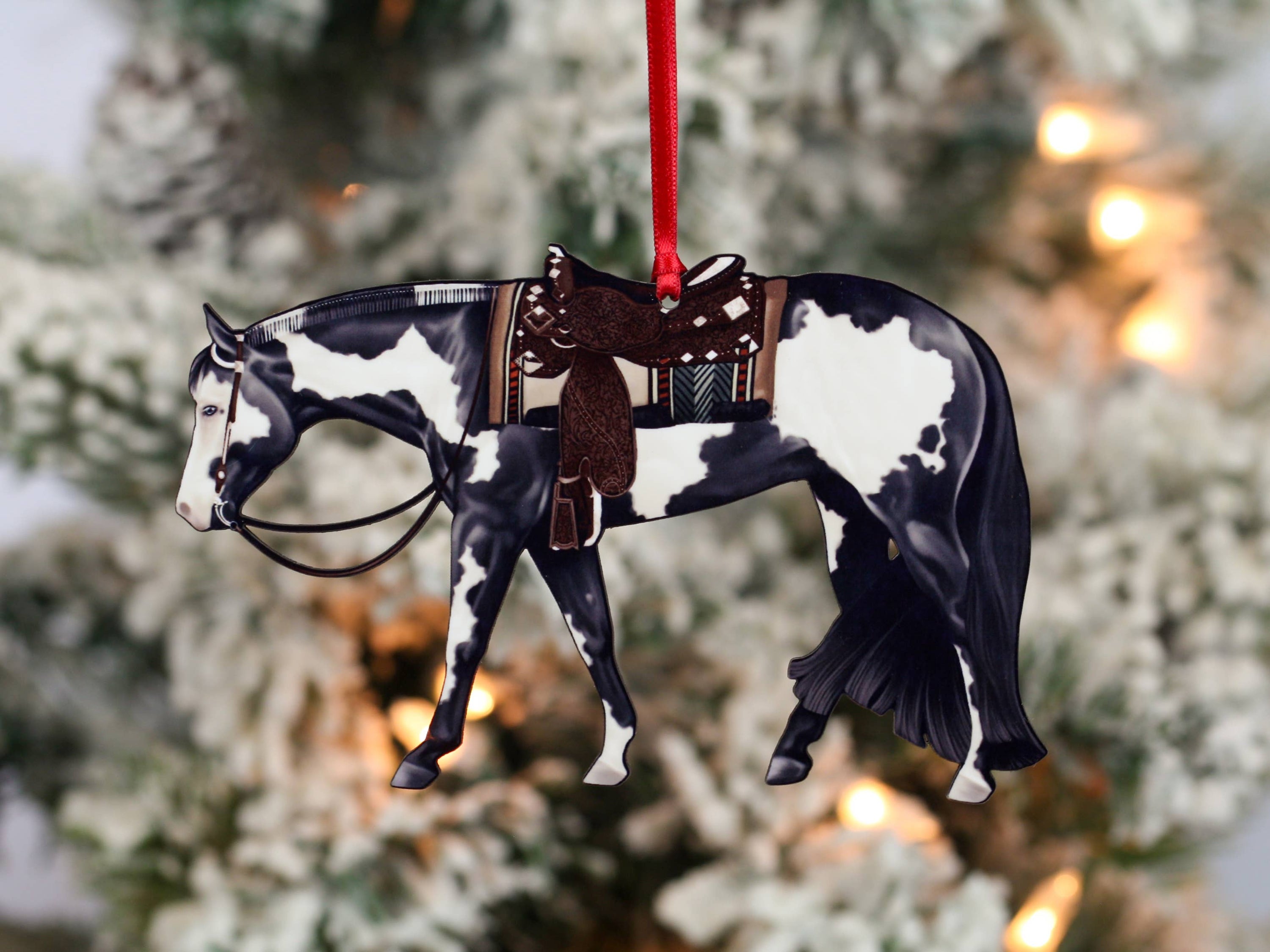 Black and white tobiano Paint Horse ornament, handmade from composite wood, featuring glossy front and dark brown back, perfect for holiday decor.