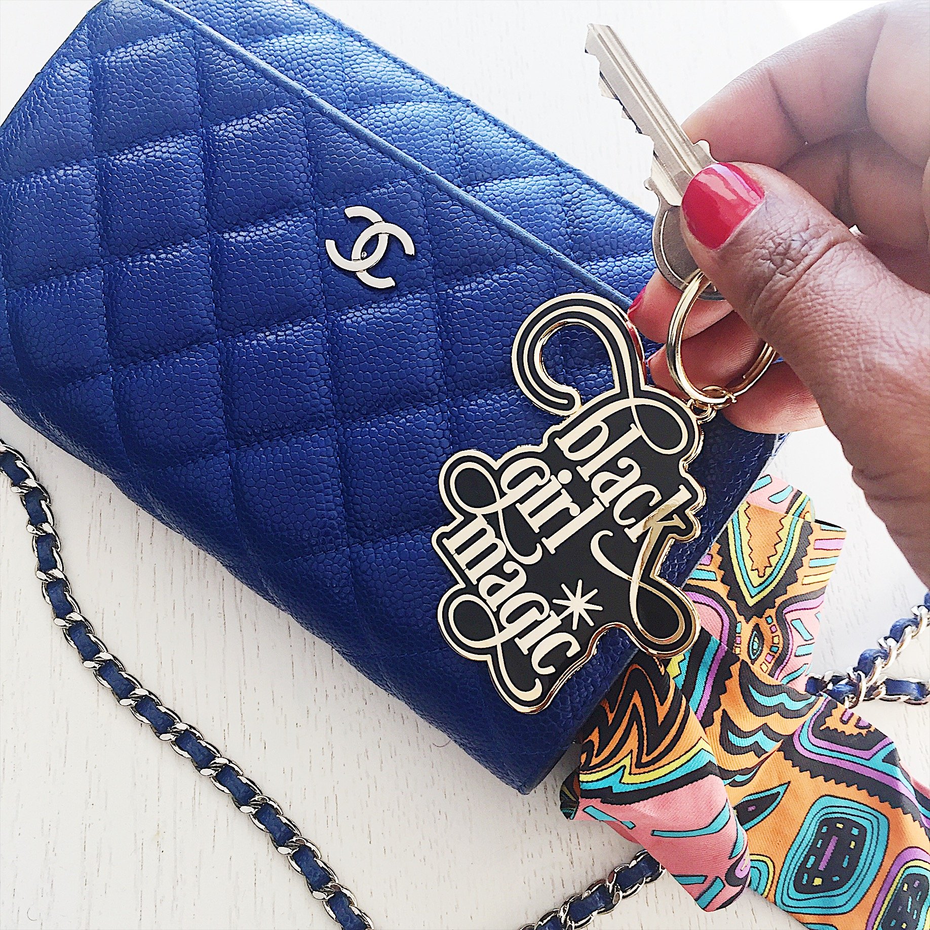 Black Girl Magic Enamel Keychain featuring a glossy finish and brass keyring, perfect for keys and bags.
