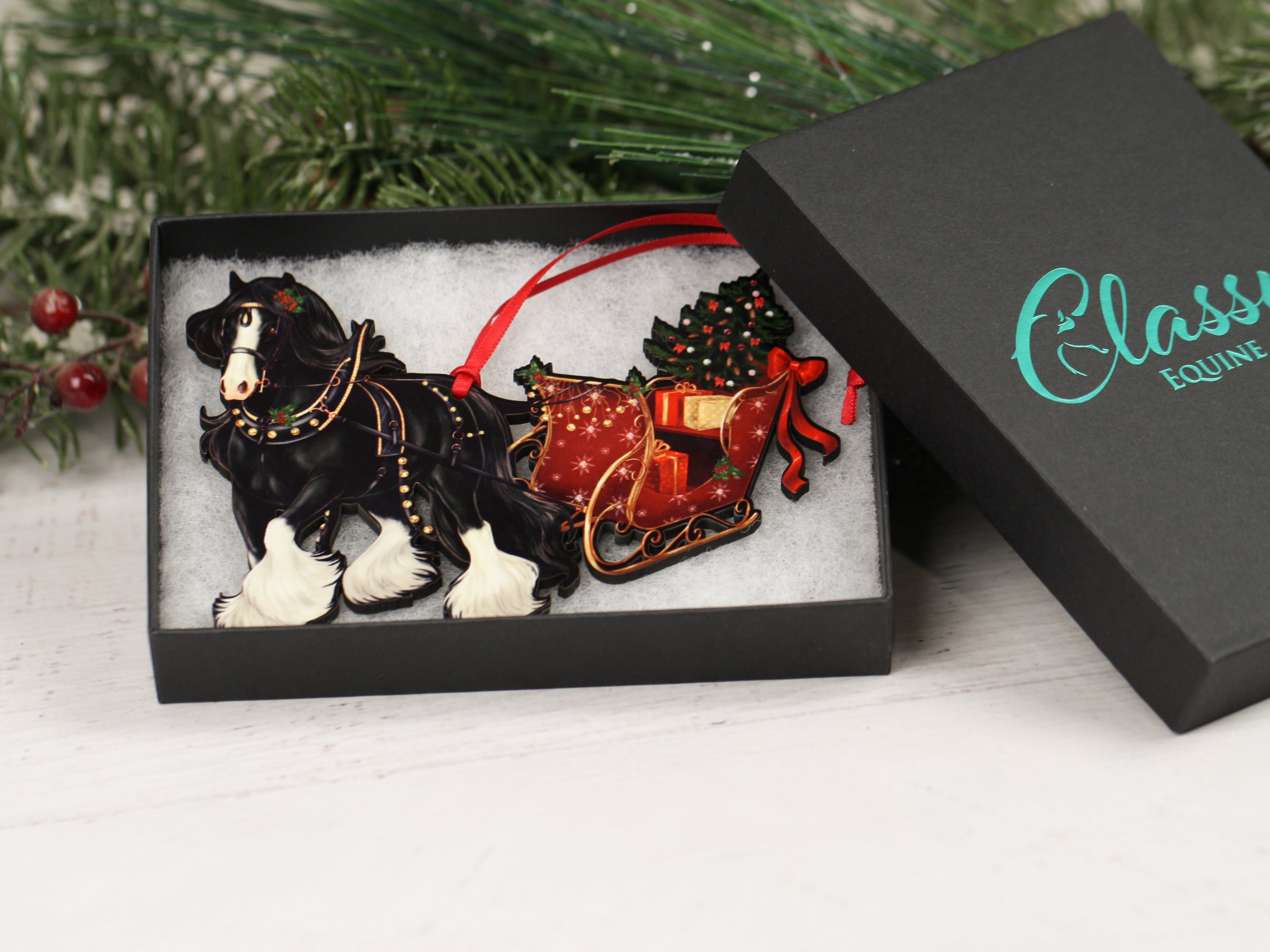 Black Gypsy Cob Horse Christmas Ornament with sleigh, handmade from composite wood, featuring a glossy front and dark brown back.