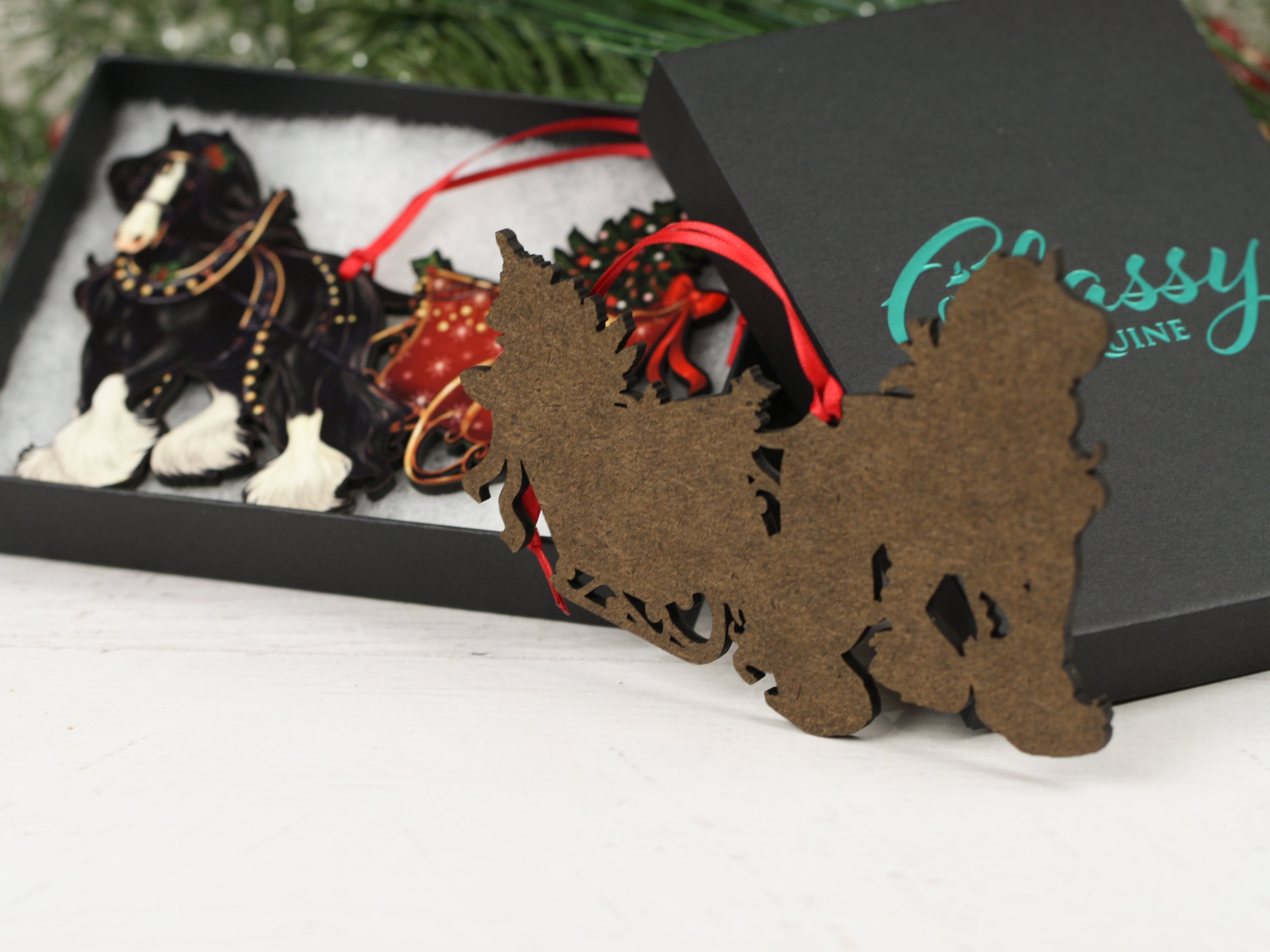 Black Gypsy Cob Horse Christmas Ornament with sleigh, handmade from composite wood, featuring a glossy front and dark brown back.