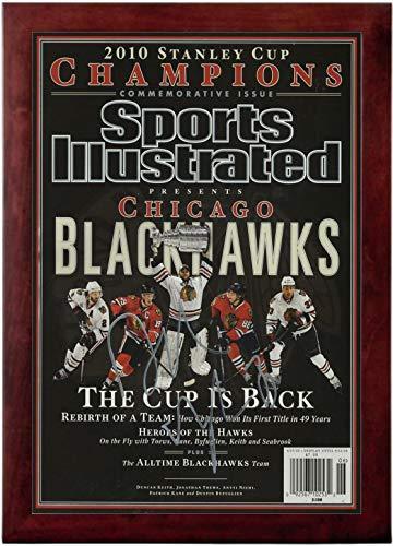Black Hawks Champions Sports Illustrated Autograph print, featuring vibrant colors and a printed signature, framed in black.