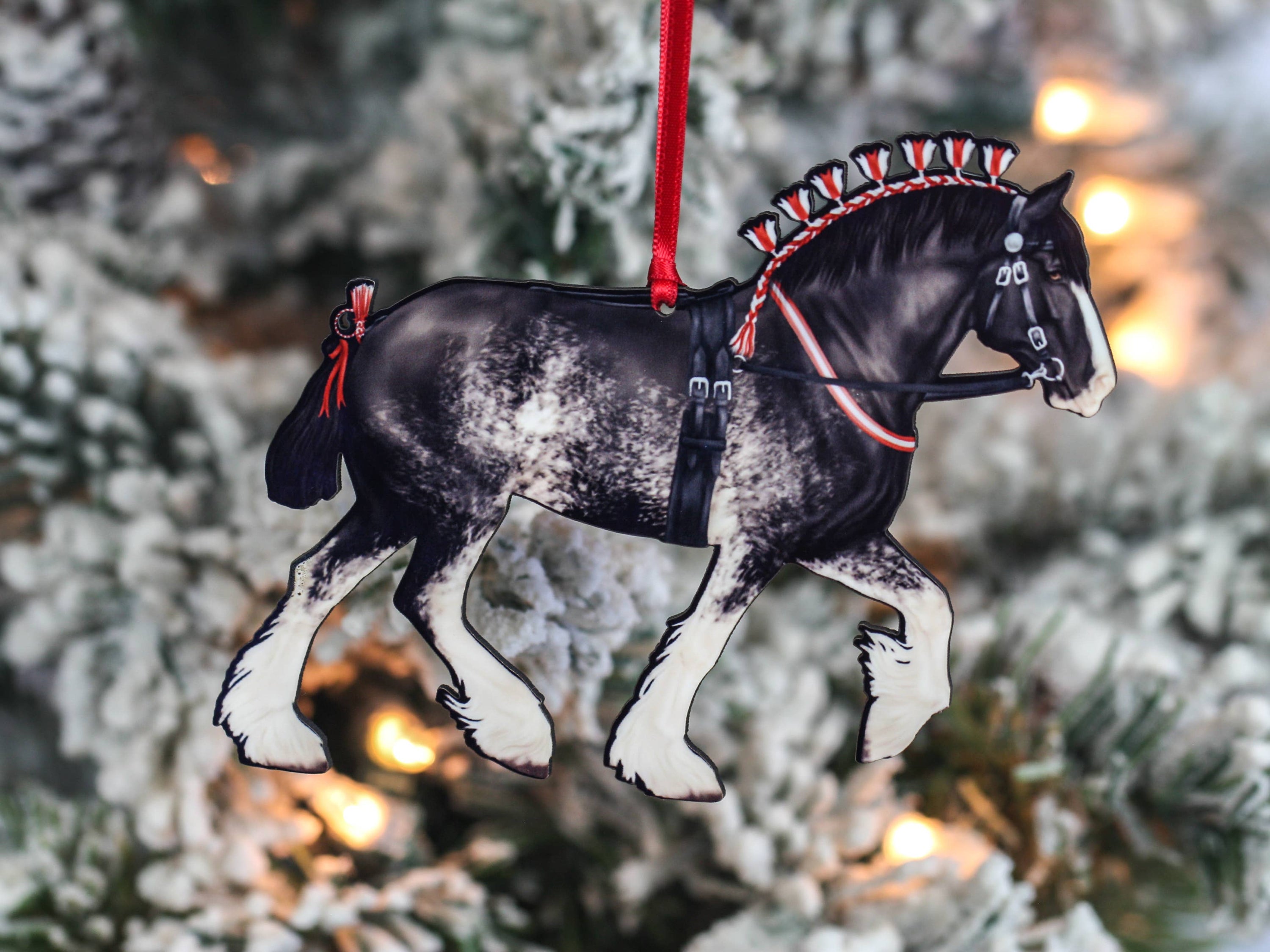 Handcrafted Black Sabino Shire Draft Horse Christmas Ornament with red and black ribbons, showcasing intricate laser-cut details.