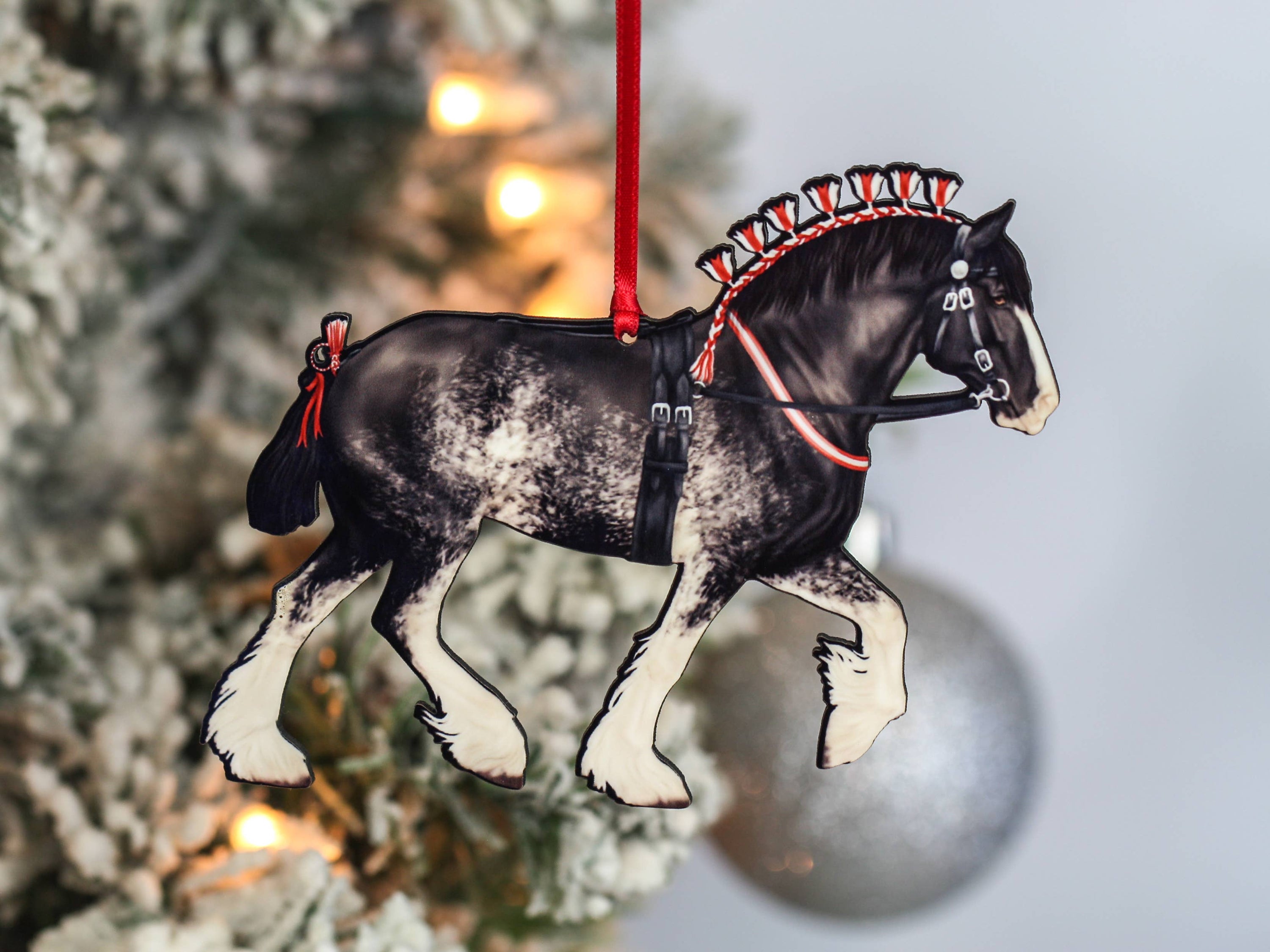 Handcrafted Black Sabino Shire Draft Horse Christmas Ornament with red and black ribbons, showcasing intricate laser-cut details.