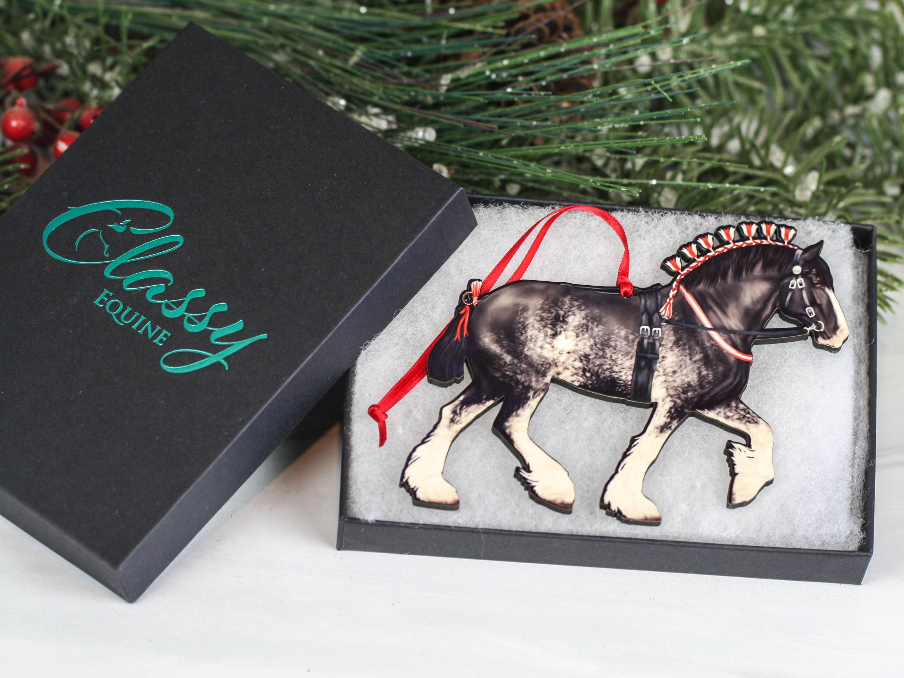 Handcrafted Black Sabino Shire Draft Horse Christmas Ornament with red and black ribbons, showcasing intricate laser-cut details.