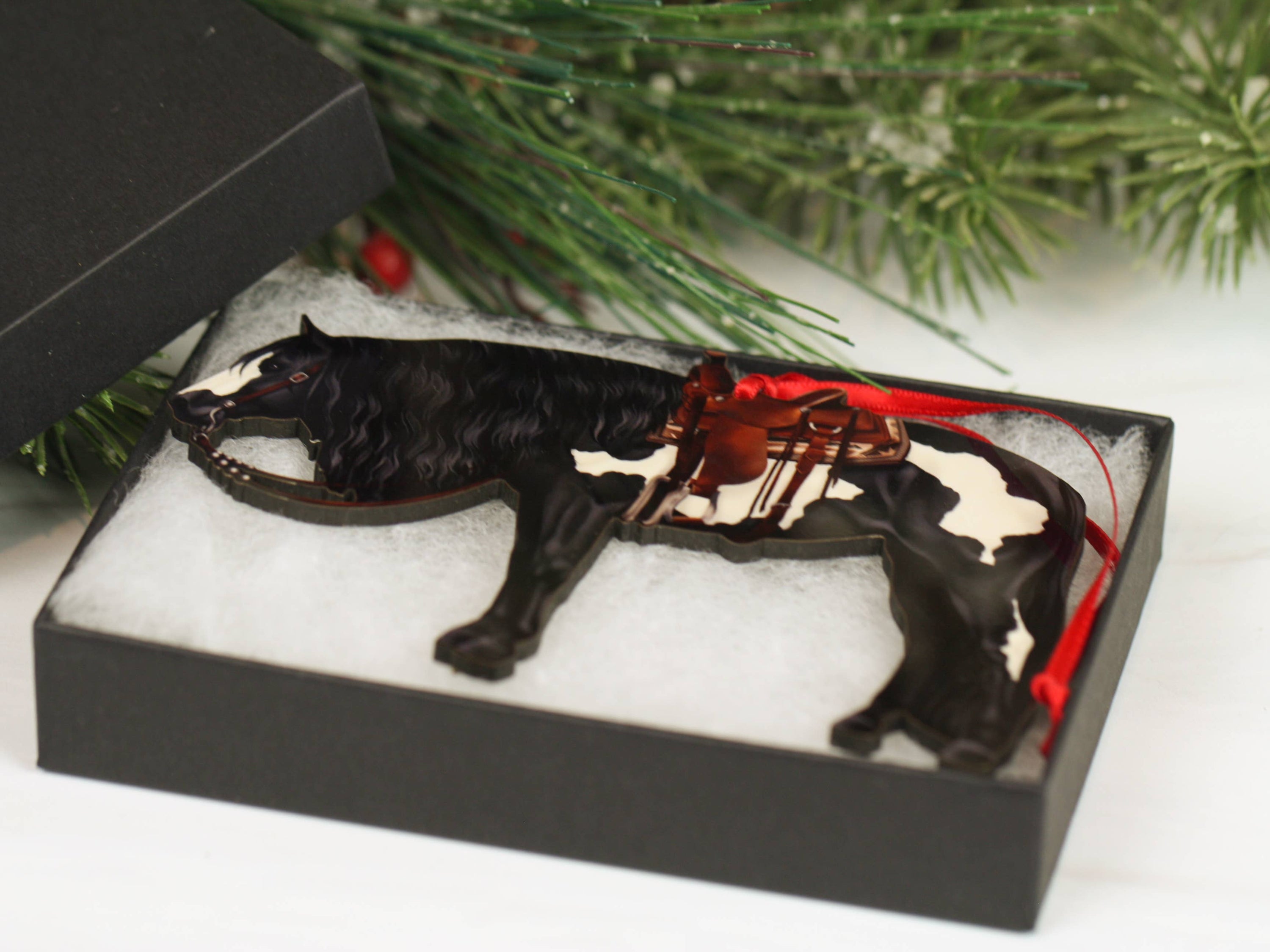 Black and white tobiano western Paint Horse ornament, handmade from composite wood, perfect for Christmas decor.