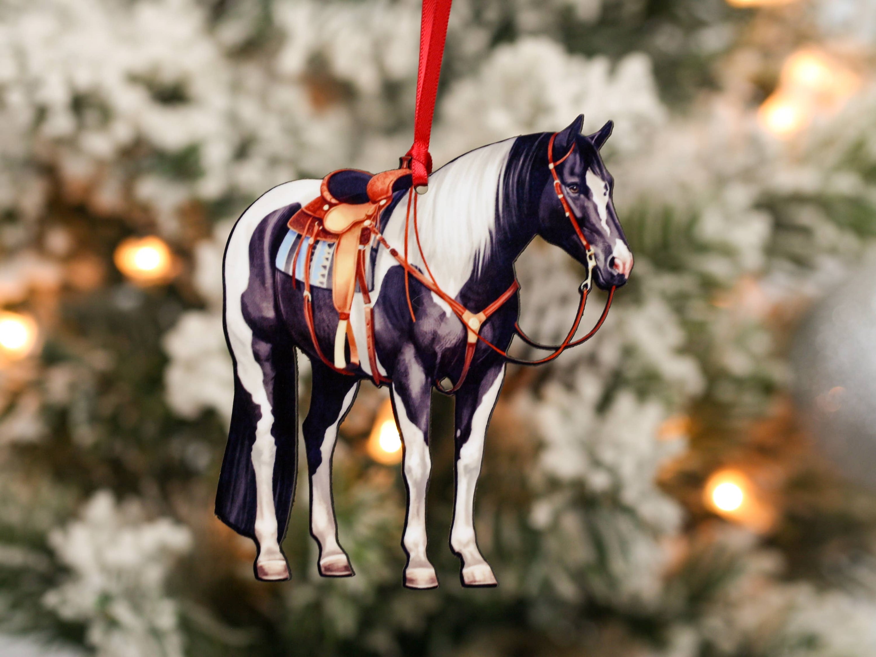 Black and white tobiano western ranch horse ornament made of composite wood, featuring a glossy front and dark brown back, perfect for equestrian decor.
