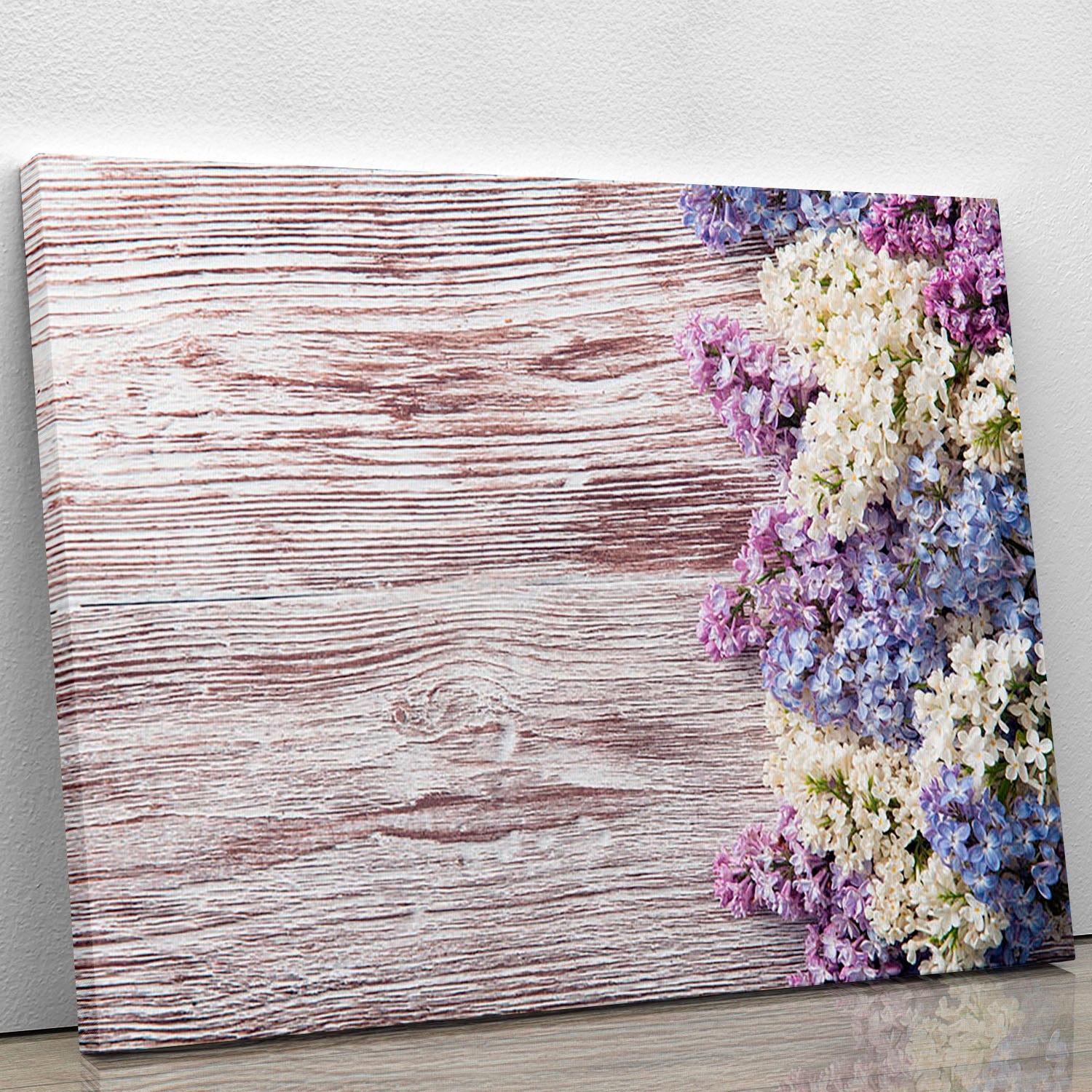 A beautiful Blossom branch canvas print featuring delicate flowers on a wooden background, perfect for home decor.