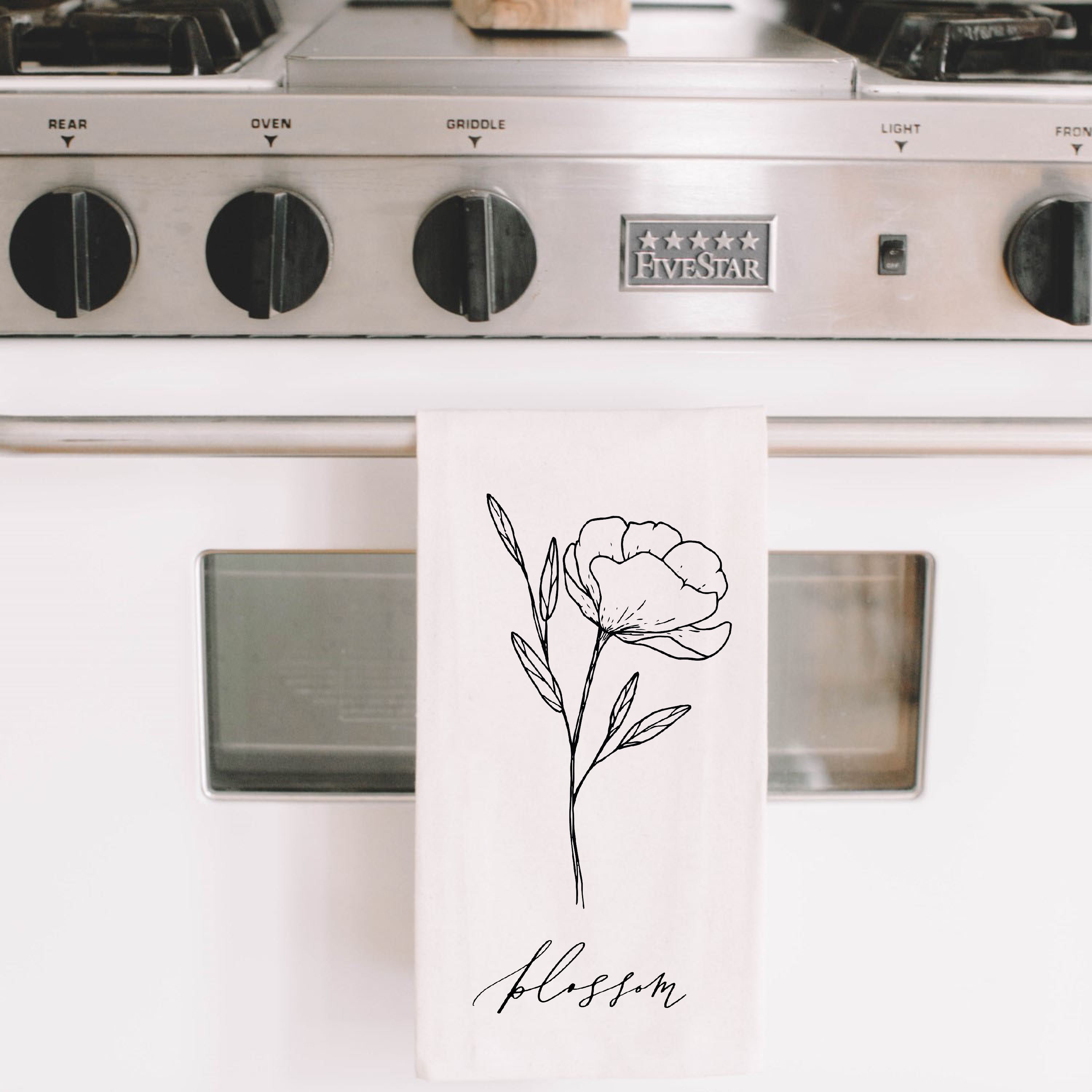 Blossom Wildflower Kitchen Towel featuring a floral design, made from 100% organic cotton in white and natural colors.