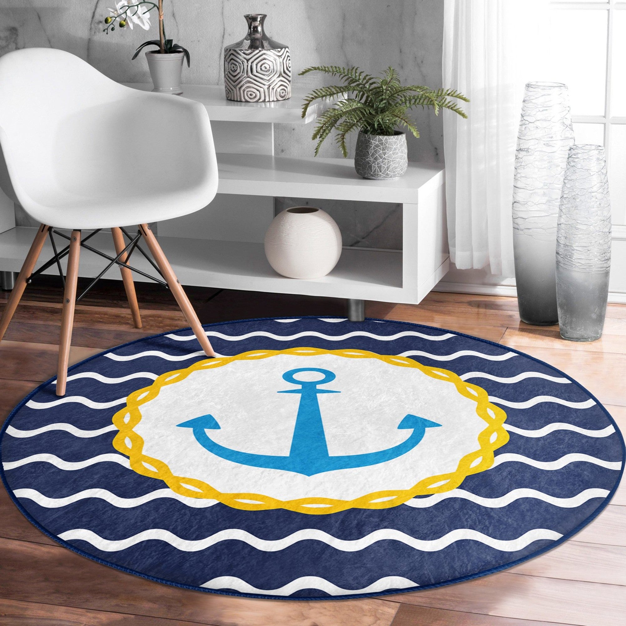 A round rug featuring a deep blue anchor pattern, perfect for marine-themed decor, showcasing its soft texture and vibrant colors.