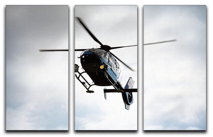 A blue and silver police helicopter depicted in a stunning 3-panel canvas art set, showcasing vibrant colors and dynamic design.