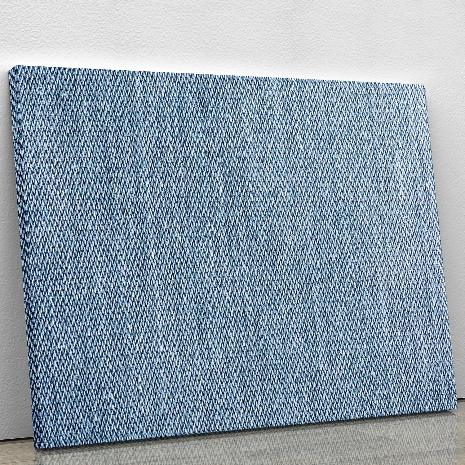 A beautiful canvas print featuring a blue denim texture, showcasing intricate details and a stylish design suitable for various decor styles.