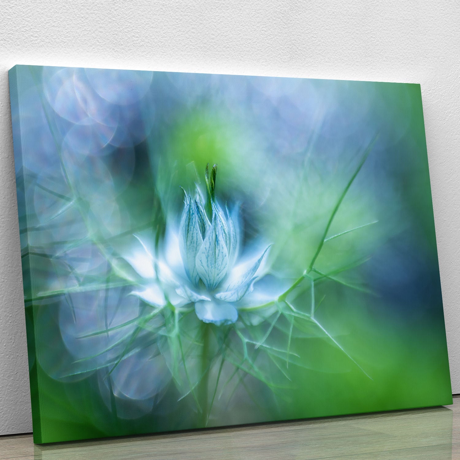A vibrant blue flower canvas print showcasing intricate details and rich colors, perfect for home or office decor.