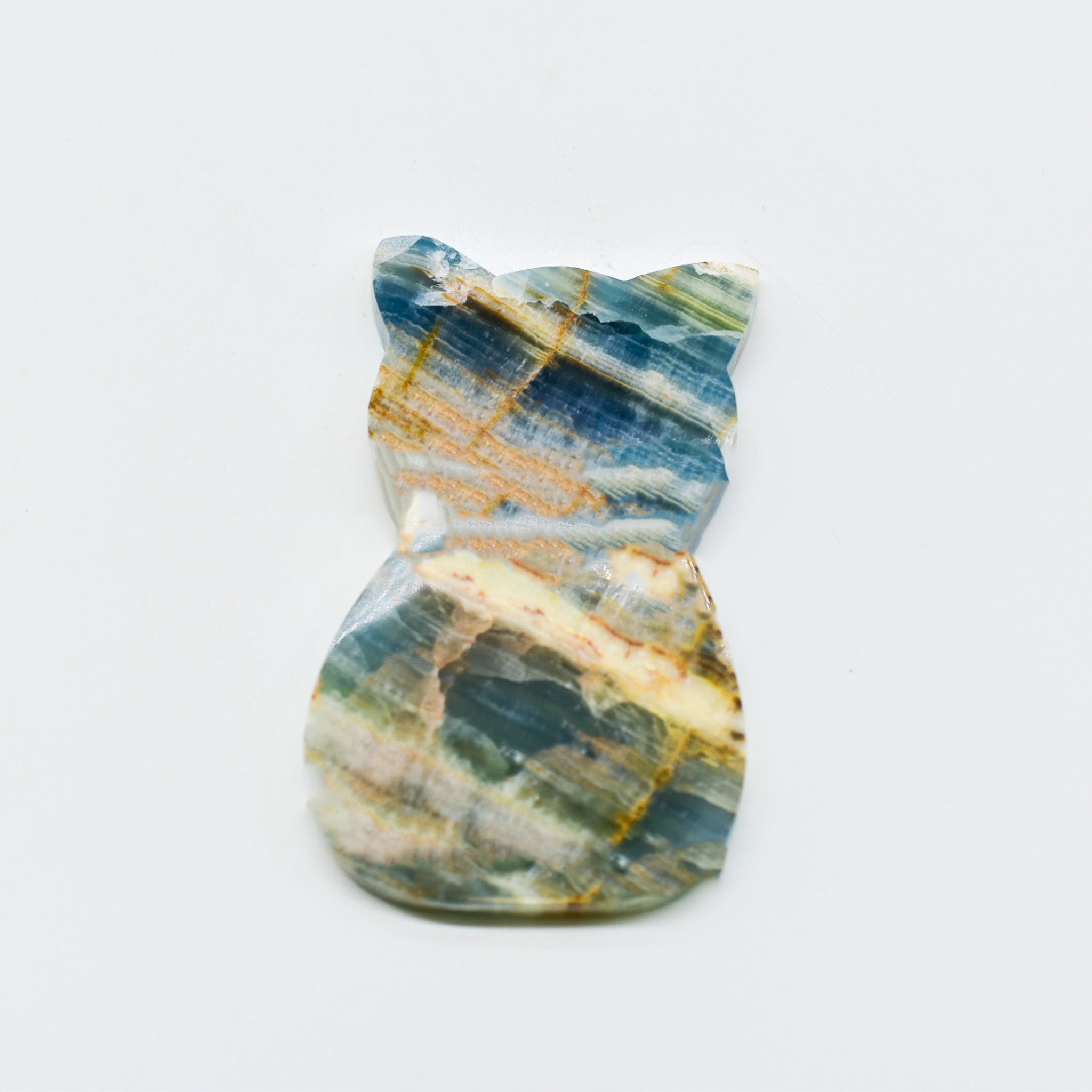 Two cat-shaped crystals made of Blue Onyx and Orange Calcite, showcasing their vibrant colors and unique design.