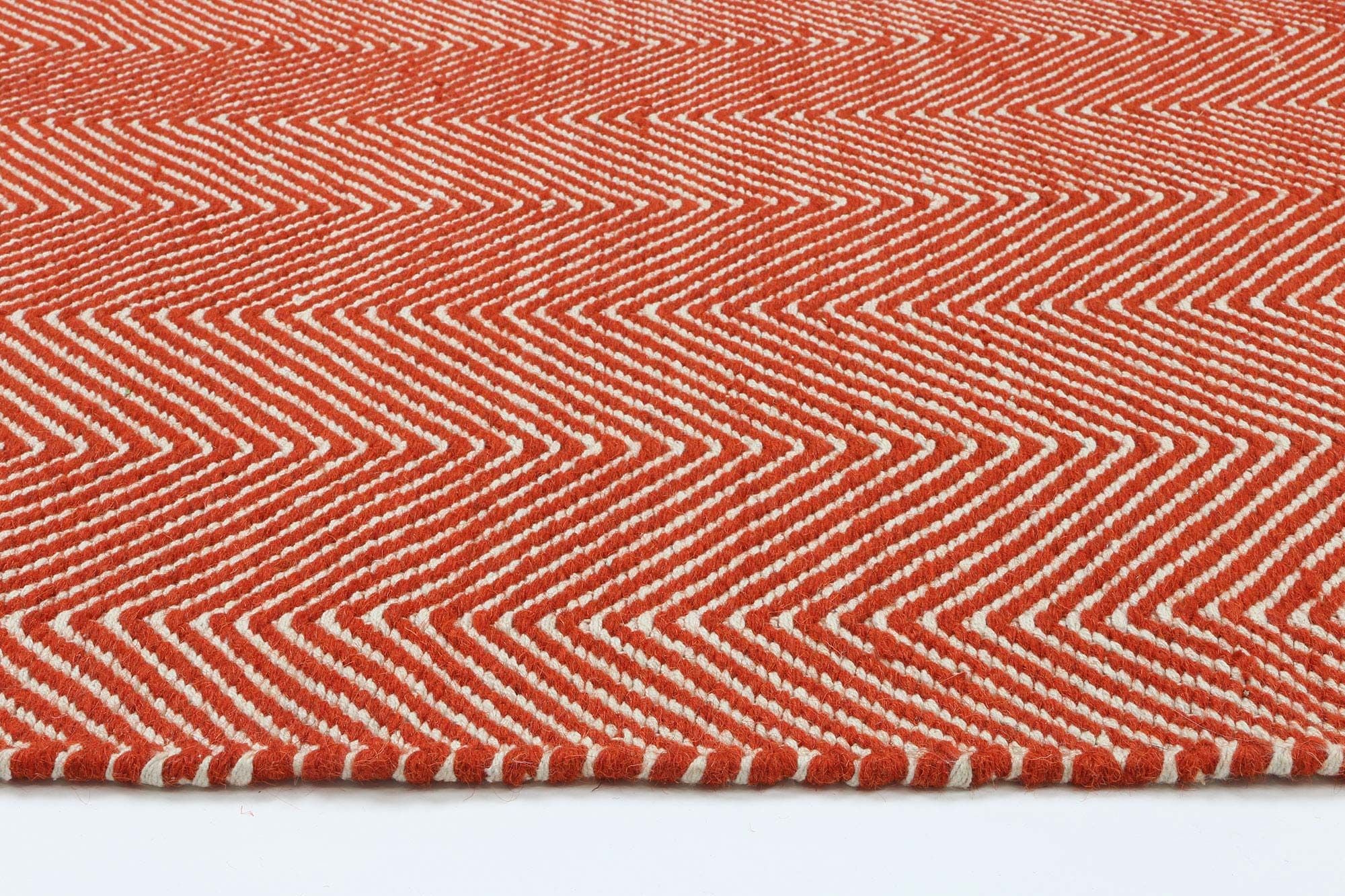 Bondi Chevron Orange Rug measuring 200x290 cm, featuring a vibrant orange color with classic Ikat tie-dye patterns, hand-crafted in India.