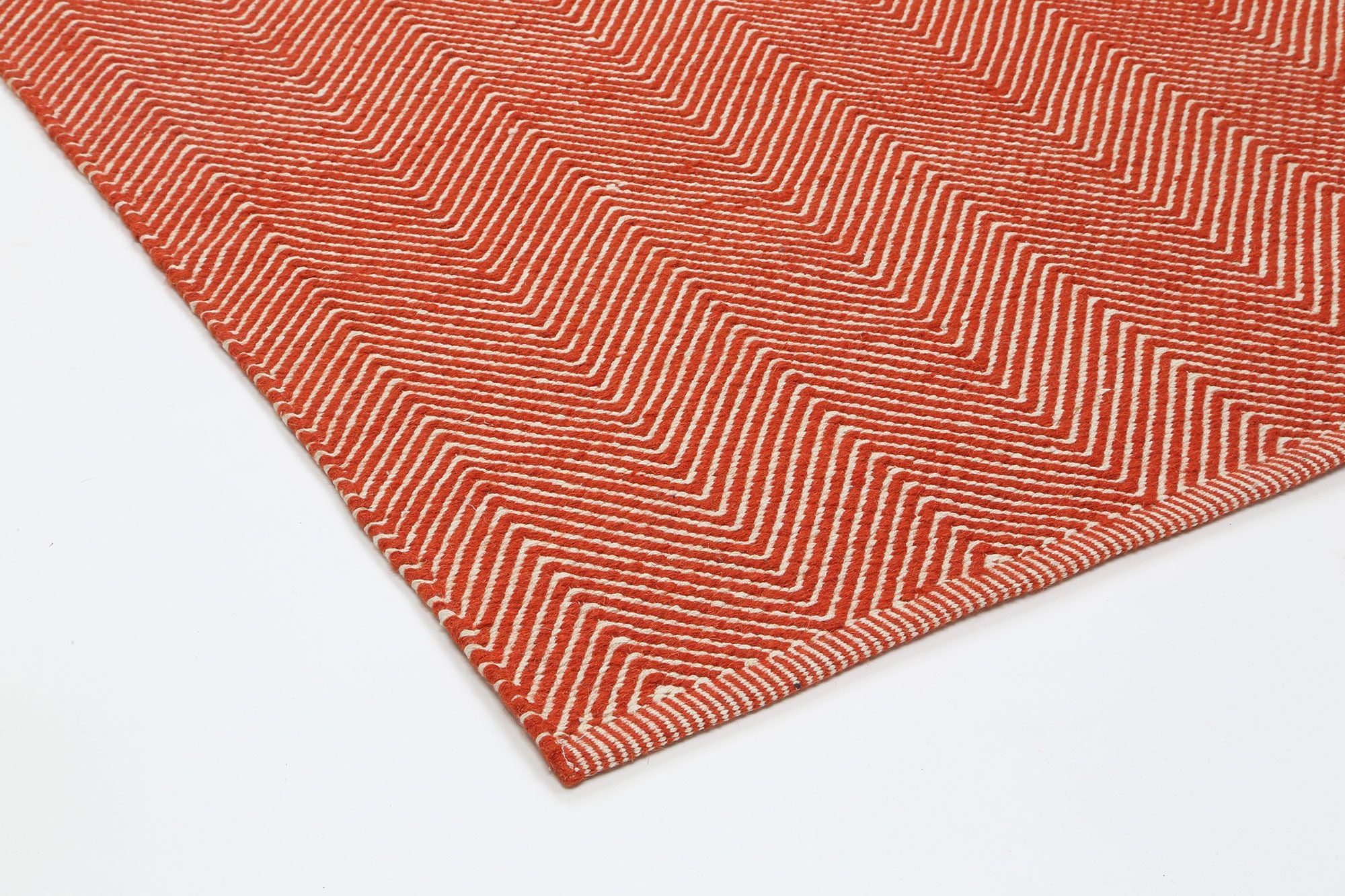 Bondi Chevron Orange Rug measuring 200x290 cm, featuring a vibrant orange color with classic Ikat tie-dye patterns, hand-crafted in India.