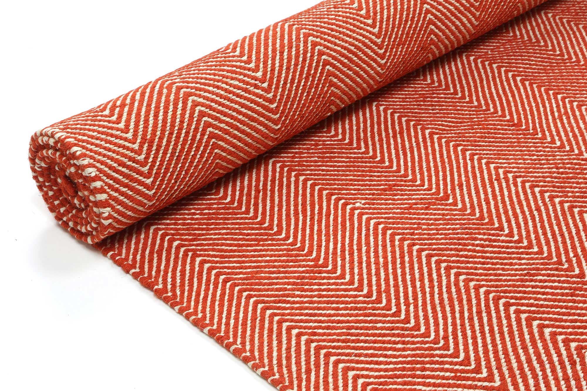 Bondi Chevron Orange Rug measuring 200x290 cm, featuring a vibrant orange color with classic Ikat tie-dye patterns, hand-crafted in India.