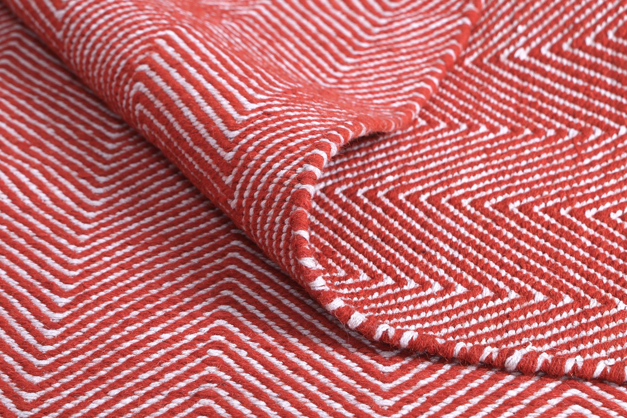 Bondi Chevron Orange Rug measuring 200x290 cm, featuring a vibrant orange color with classic Ikat tie-dye patterns, hand-crafted in India.