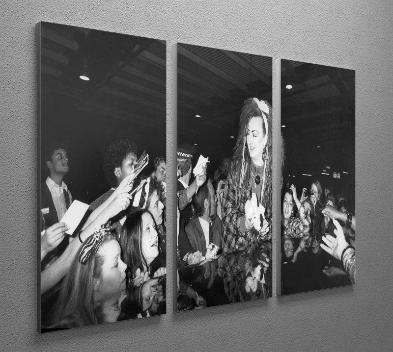 Boy George mobbed by fans 3-panel canvas print showcasing vibrant colors and dynamic design.