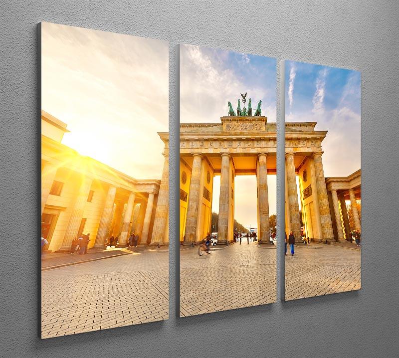 Brandenburg Gate at sunset depicted in a stunning 3-panel canvas print, showcasing vibrant colors and intricate details.