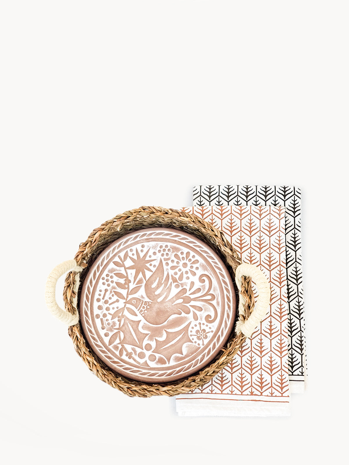 A beautifully crafted Bread Warmer & Basket Gift Set featuring a terracotta warmer, handwoven seagrass basket, and a printed tea towel, all showcasing artisan craftsmanship.