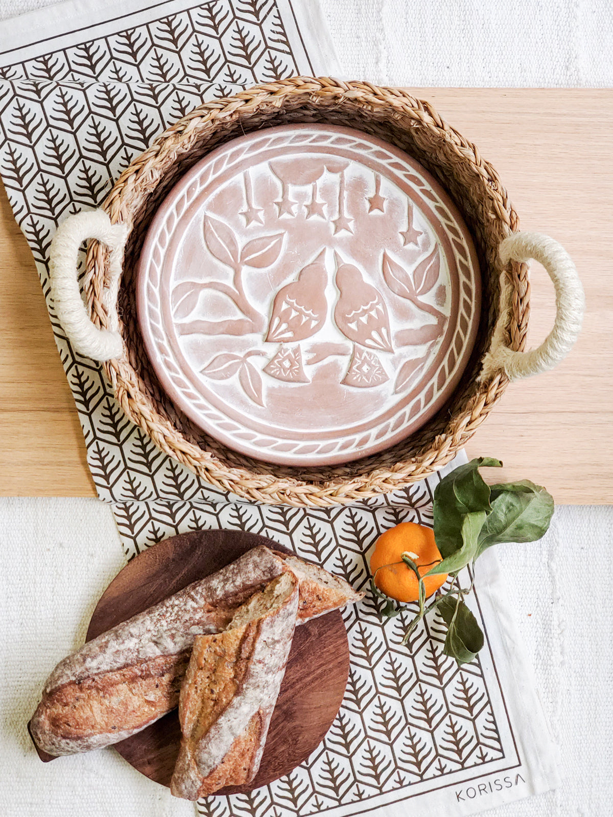 Lovebird Round Bread Warmer & Basket Gift Set featuring terracotta warmer, handwoven seagrass basket, and printed tea towel.
