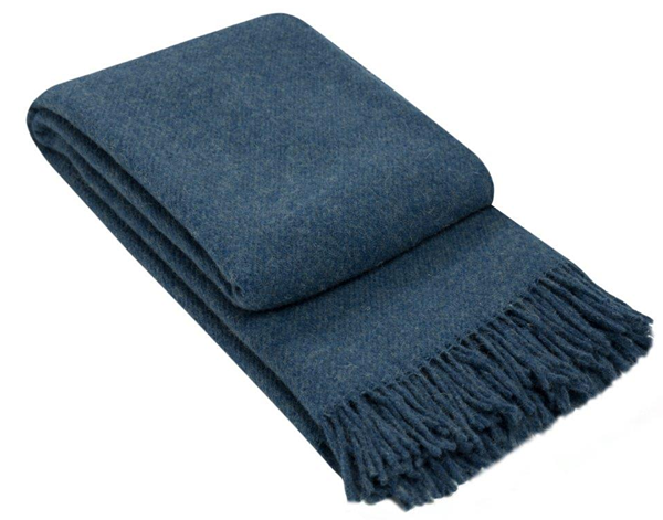 Brighton Throw blanket made from 100% New Zealand wool in navy color, showcasing its thick and cozy texture.