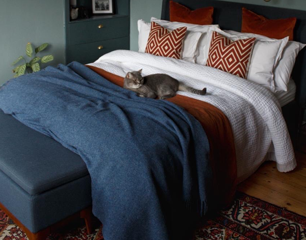 Brighton Throw blanket made from 100% New Zealand wool in navy color, showcasing its thick and cozy texture.