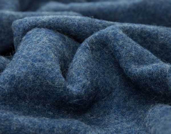 Brighton Throw blanket made from 100% New Zealand wool in navy color, showcasing its thick and cozy texture.