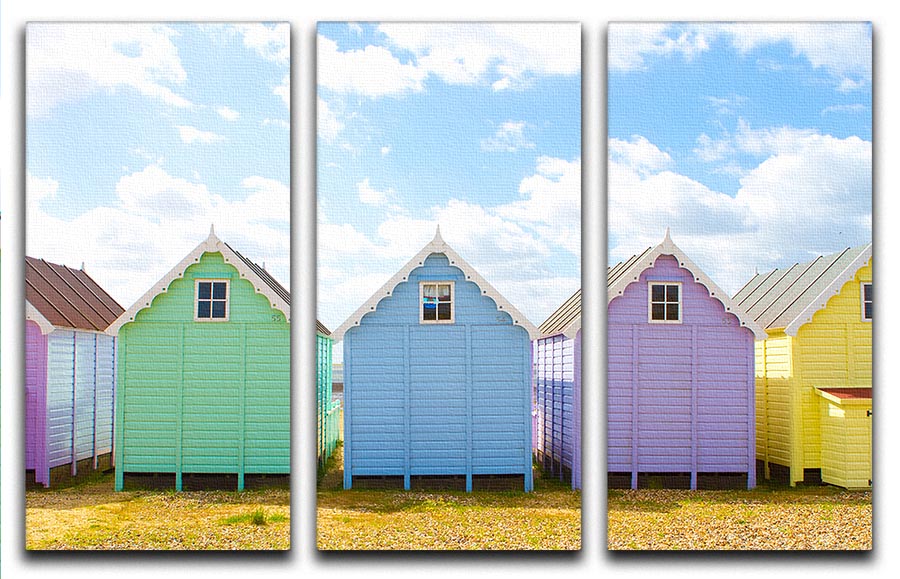 A vibrant 3-panel canvas print featuring British beach huts under a bright sunny sky, perfect for home decor.