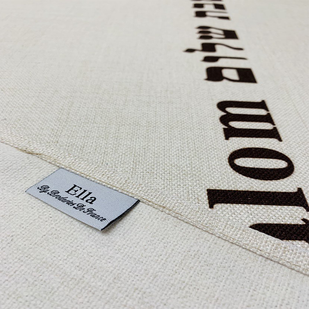 Brown Shabbat Shalom tablecloth featuring Shabbat Shalom stripes in English and Hebrew, adorned with Magen David and Hamsa details.