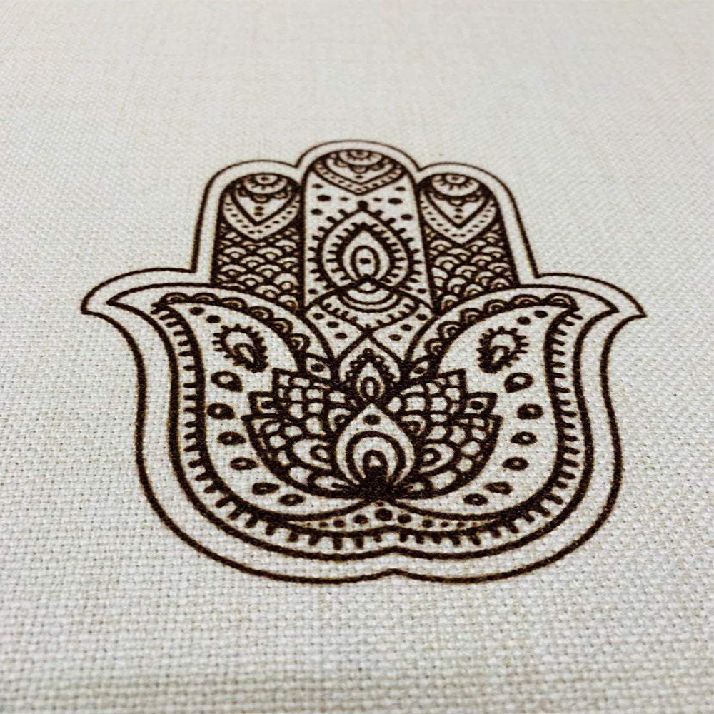 Brown Shabbat Shalom tablecloth featuring Shabbat Shalom stripes in English and Hebrew, adorned with Magen David and Hamsa details.