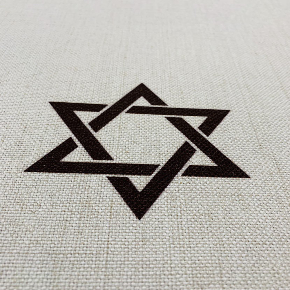 Brown Shabbat Shalom tablecloth featuring Shabbat Shalom stripes in English and Hebrew, adorned with Magen David and Hamsa details.