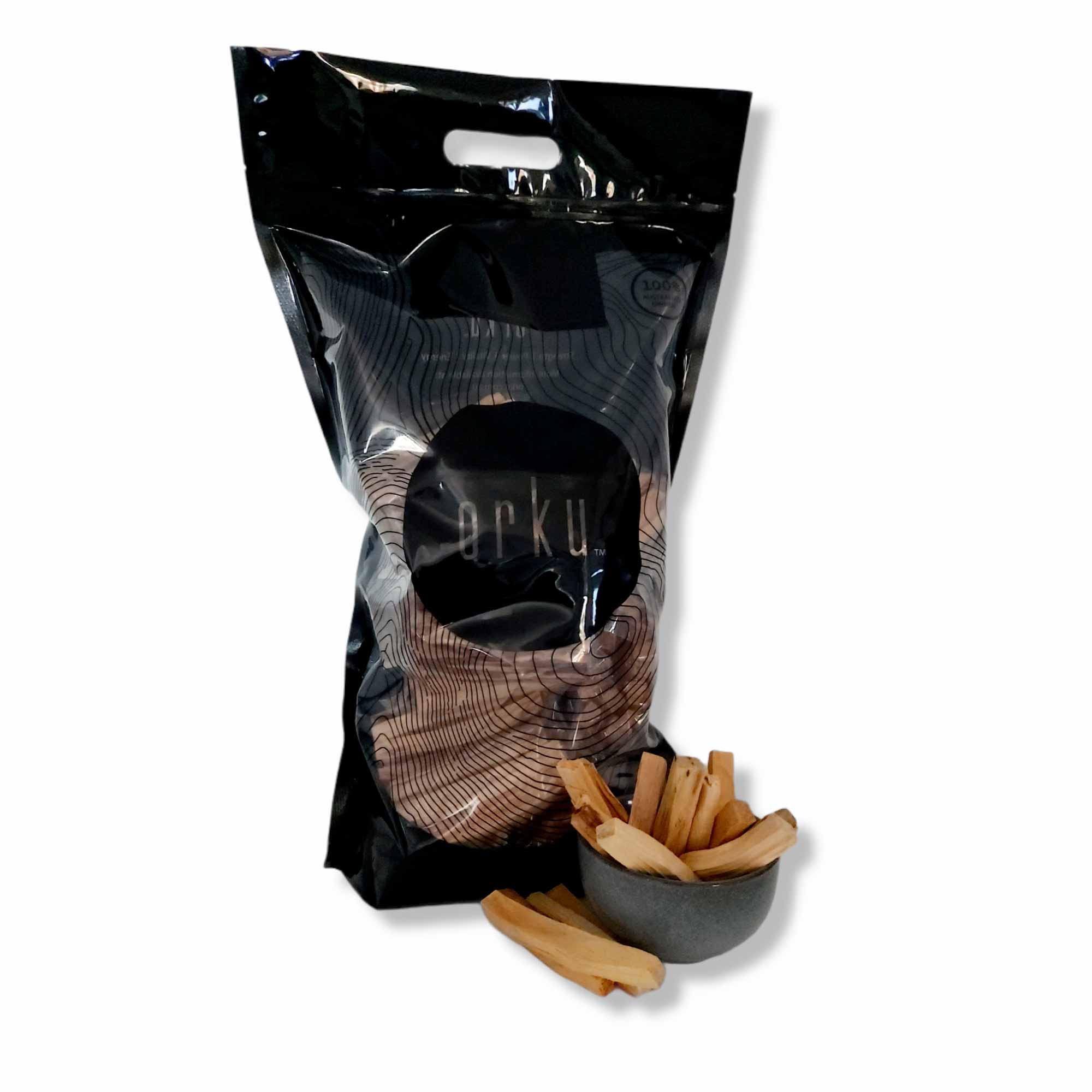 Bulk 1Kg Palo Santo smudge sticks displayed in a natural setting, showcasing their rustic appearance and organic quality.