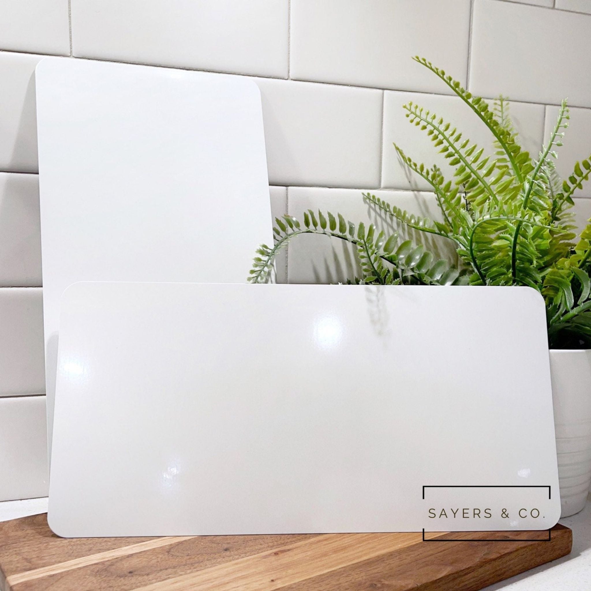 Bulk pack of 6” x 12” white sublimation sign blanks, ideal for crafting and personalized projects.