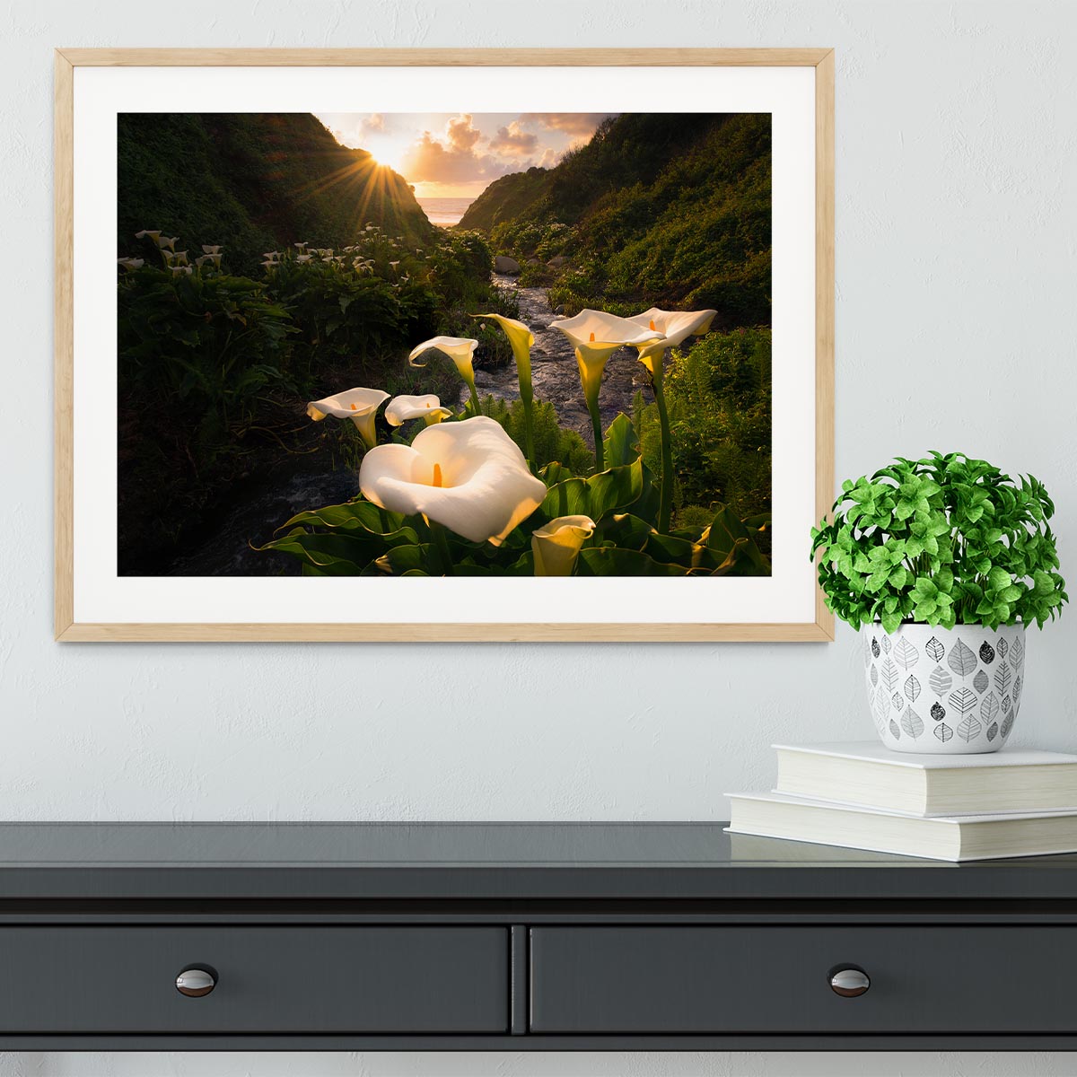 A beautifully framed Calla Lily print showcasing vibrant colors and quality craftsmanship, available in black, white, or natural wood frames.