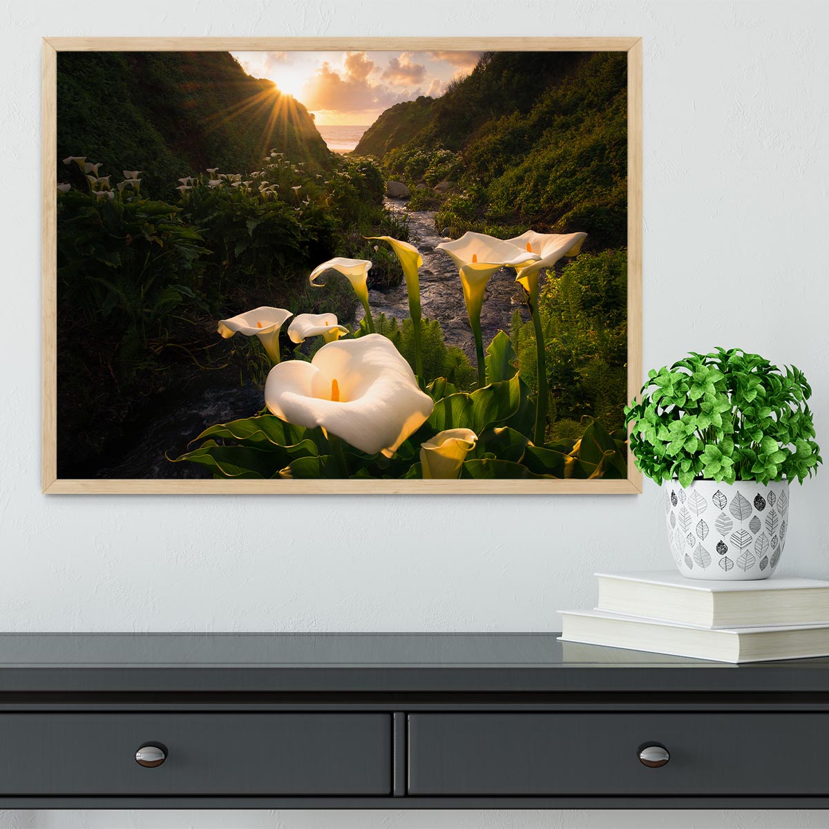 A beautifully framed Calla Lily print showcasing vibrant colors and quality craftsmanship, available in black, white, or natural wood frames.