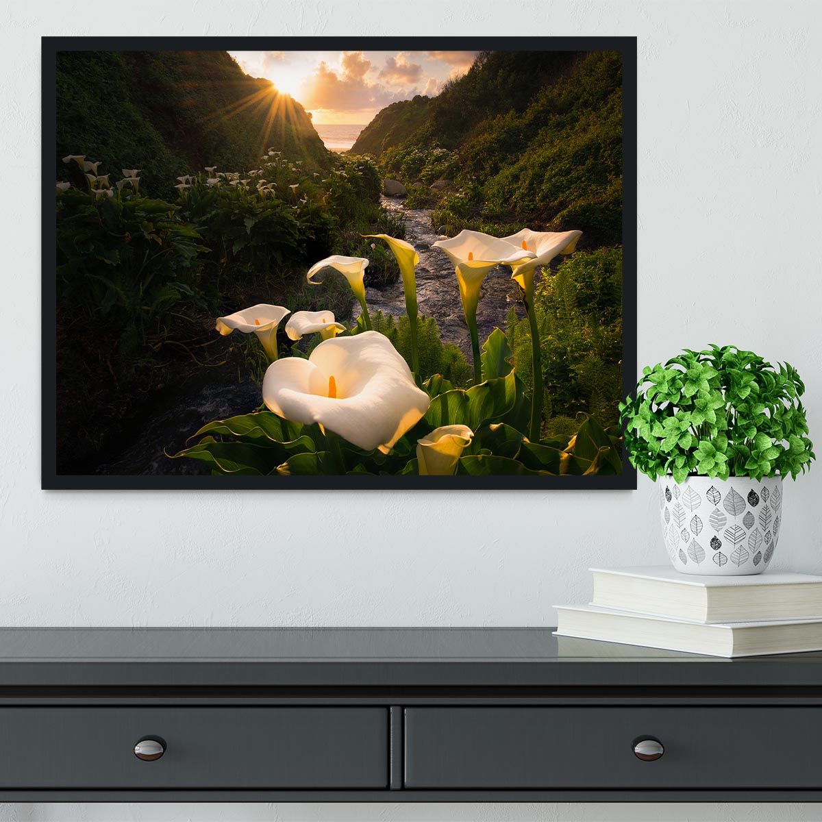 A beautifully framed Calla Lily print showcasing vibrant colors and quality craftsmanship, available in black, white, or natural wood frames.