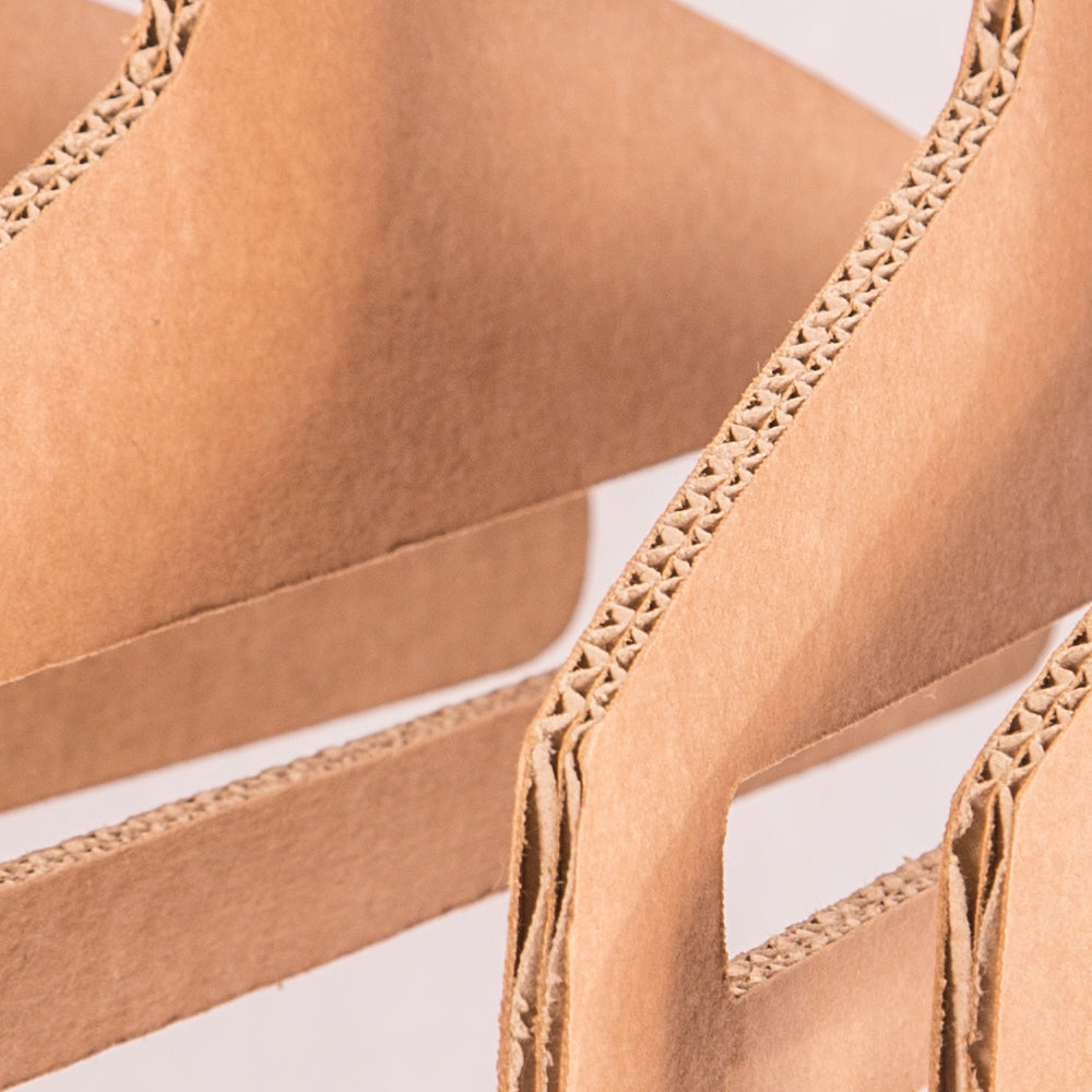 Set of 5 eco-friendly cardboard hangers for wardrobe organization, showcasing their lightweight and sturdy design.