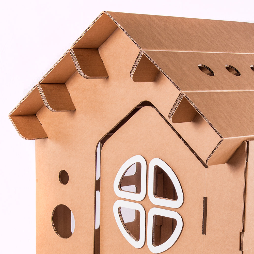 A colorful cardboard playhouse named WONDERLAND, featuring doors, windows, and a mouse door, designed for children's imaginative play.