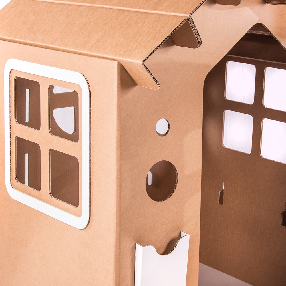 A colorful cardboard playhouse named WONDERLAND, featuring doors, windows, and a mouse door, designed for children's imaginative play.