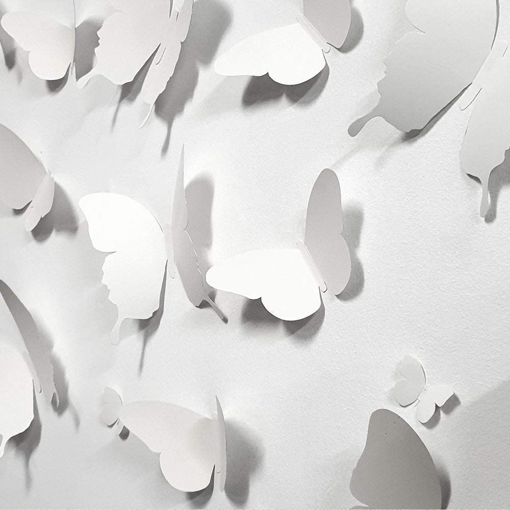 A colorful assortment of 18 cardboard 3D decorative butterflies in various sizes, perfect for wall decoration.