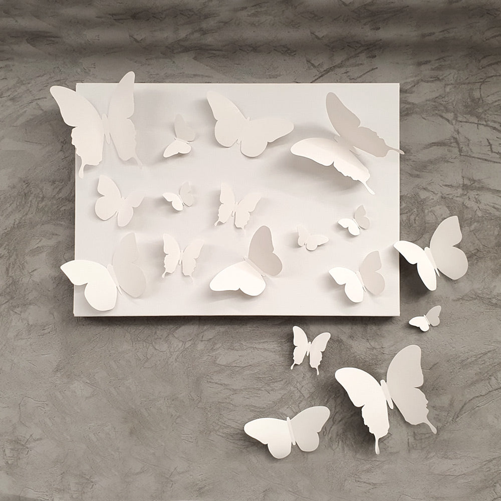 A colorful assortment of 18 cardboard 3D decorative butterflies in various sizes, perfect for wall decoration.